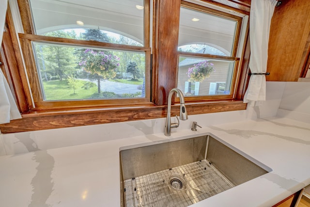 room details with sink and light stone countertops