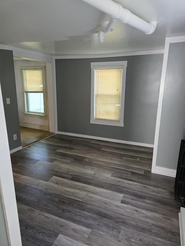 empty room featuring dark wood-type flooring