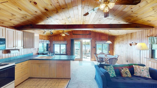 kitchen featuring white electric range, light brown cabinets, sink, kitchen peninsula, and light colored carpet