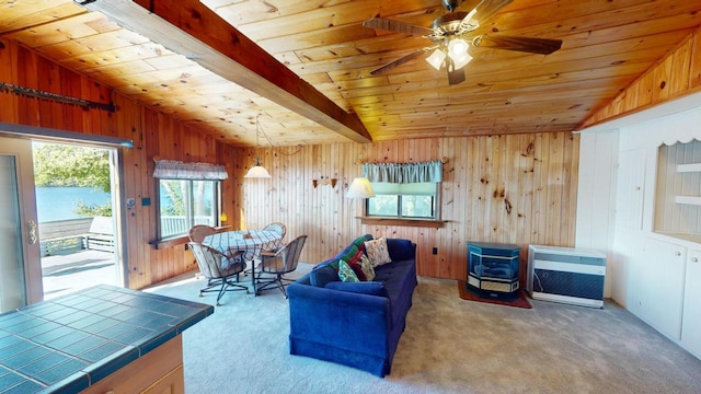 living room with heating unit, light colored carpet, lofted ceiling with beams, and wooden ceiling