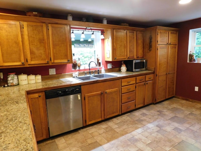 kitchen with appliances with stainless steel finishes and sink