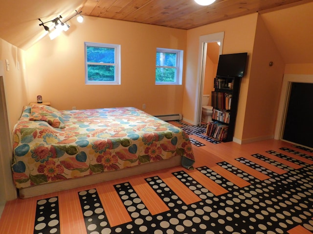 bedroom featuring baseboard heating, track lighting, wood ceiling, and light hardwood / wood-style flooring