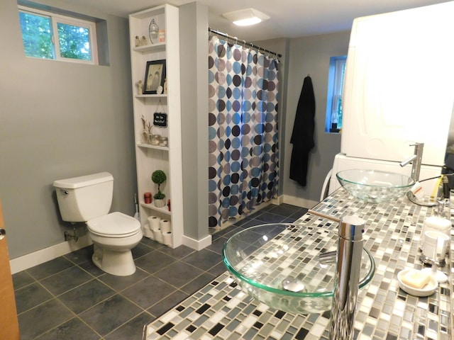 bathroom with tile patterned flooring, toilet, vanity, and a shower with shower curtain