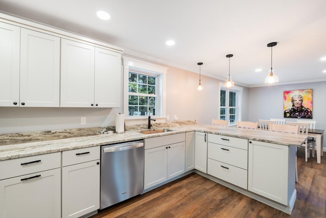 kitchen with crown molding, a peninsula, stainless steel dishwasher, dark wood-style floors, and a sink