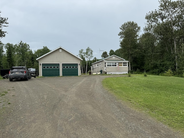 view of front of house with a front lawn, a porch, and a garage