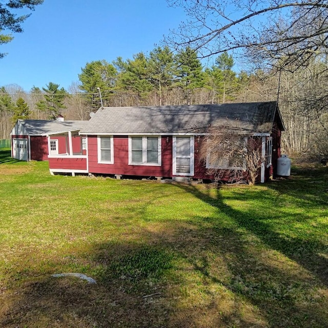 78 Clarks Cove Rd, South Bristol, ME 04573 - ranch-style house featuring a front lawn and a shingled roof