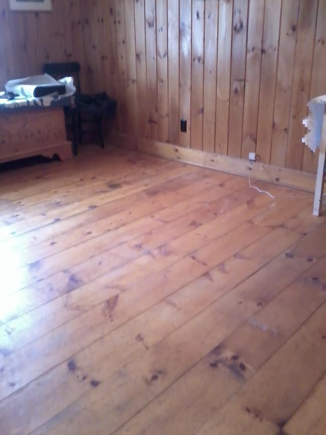 78 Clarks Cove Rd, South Bristol, ME 04573 - unfurnished bedroom with hardwood / wood-style floors and wooden walls