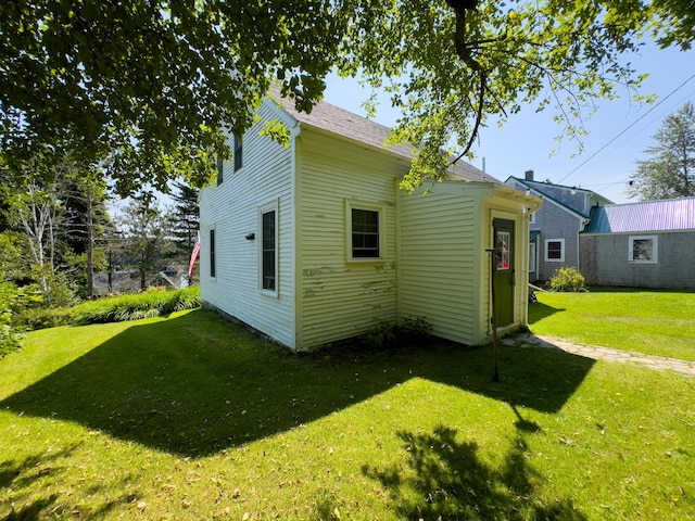 rear view of house with a lawn