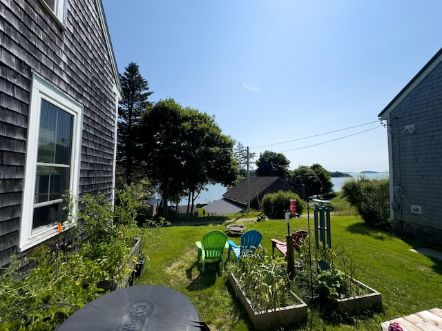 view of yard with a water view