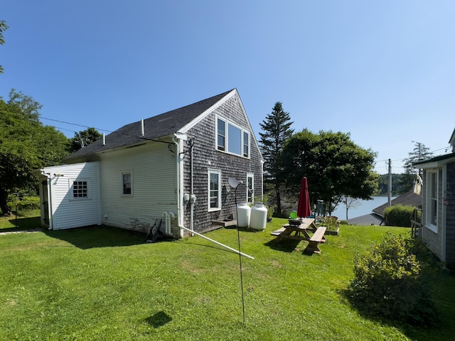 view of side of home featuring a lawn