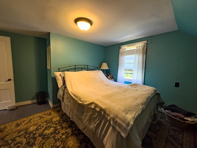 bedroom featuring vaulted ceiling