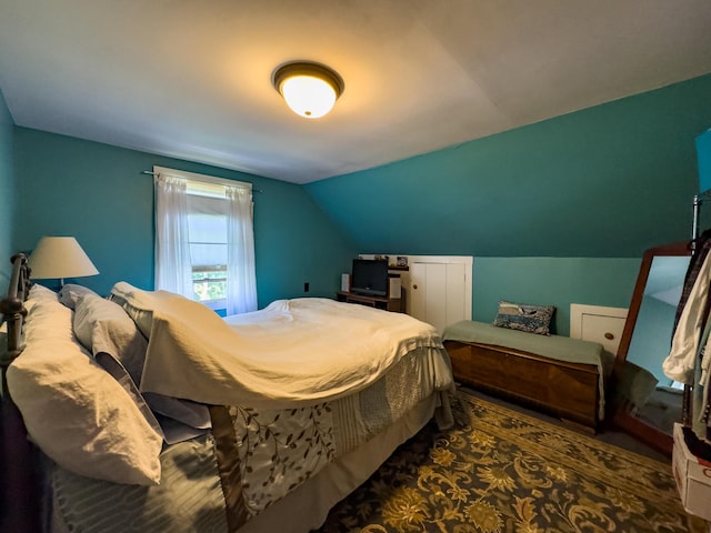 bedroom featuring lofted ceiling