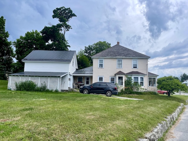 view of front of home with a front yard