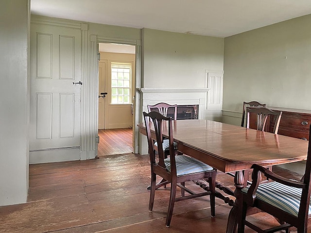 dining room with dark hardwood / wood-style flooring