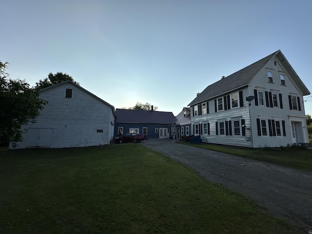 view of home's exterior with a yard