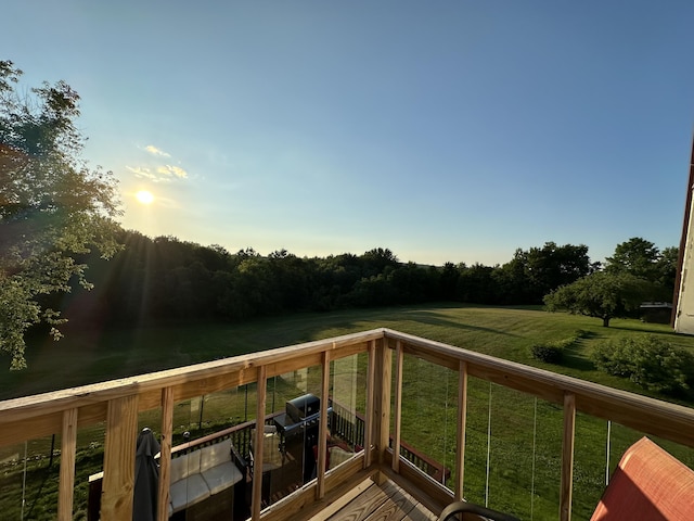 deck at dusk with a yard