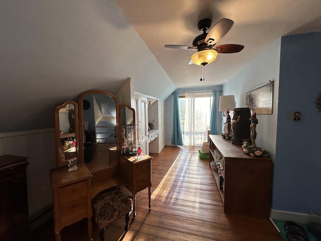 interior space with lofted ceiling, wood-type flooring, and ceiling fan