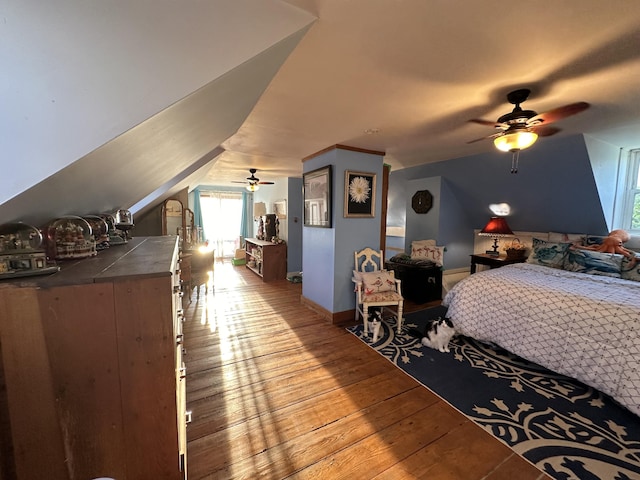 bedroom featuring lofted ceiling, ceiling fan, and light hardwood / wood-style floors