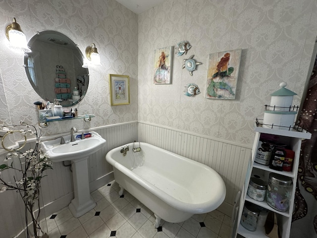 bathroom with tile patterned flooring and a bathing tub