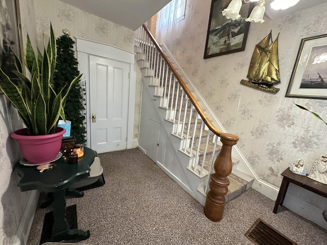 stairway with carpet floors