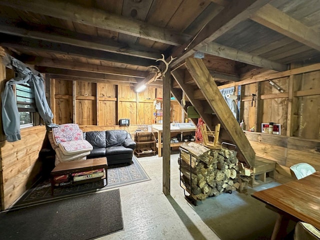 basement with wooden ceiling and wood walls