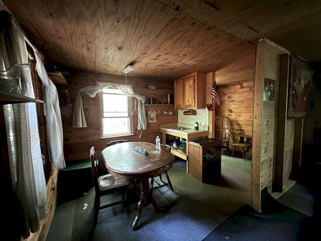 dining area featuring wood walls