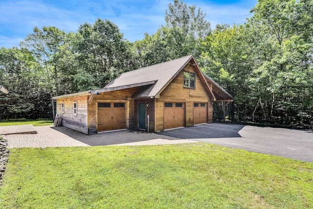 garage with a lawn