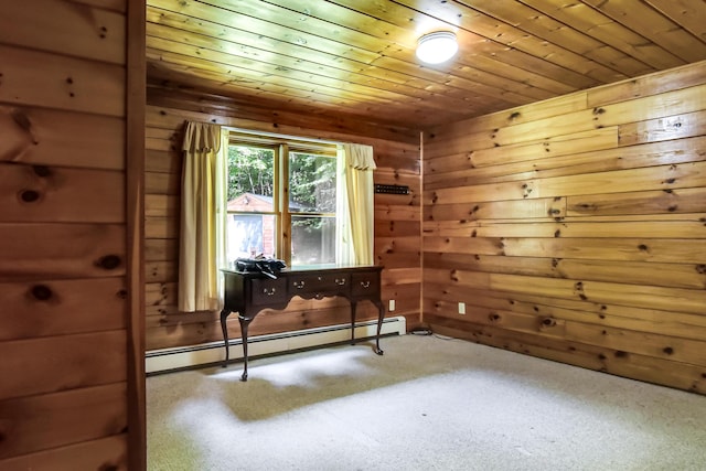 interior space featuring carpet, wooden ceiling, baseboard heating, and wooden walls
