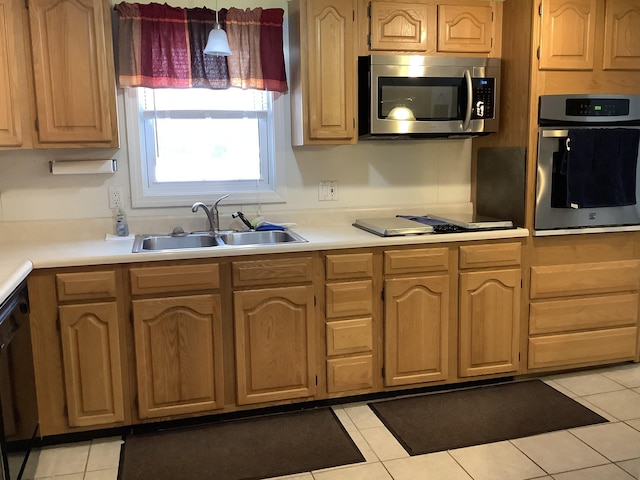 kitchen with black appliances, light tile patterned floors, and sink