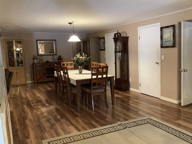 dining space featuring dark hardwood / wood-style floors