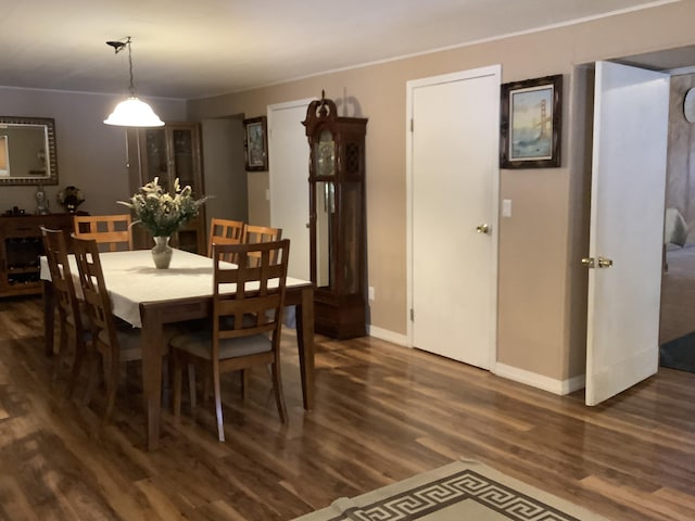 dining room with dark hardwood / wood-style flooring