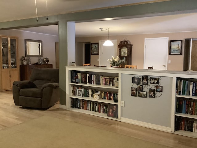 interior space with hanging light fixtures and hardwood / wood-style flooring