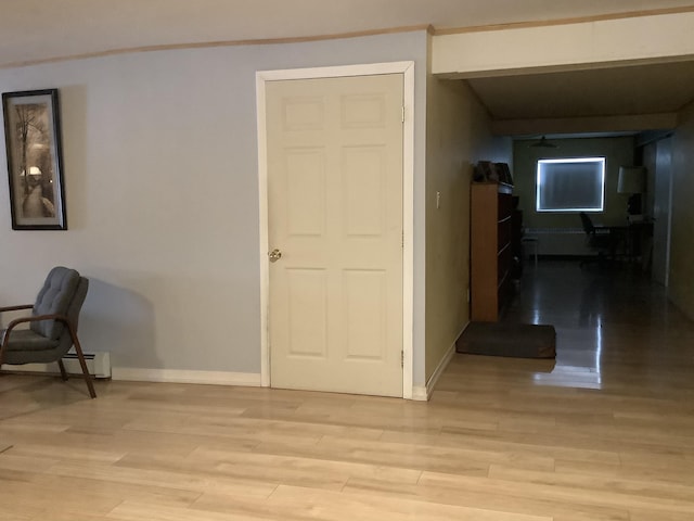 hall with light hardwood / wood-style floors