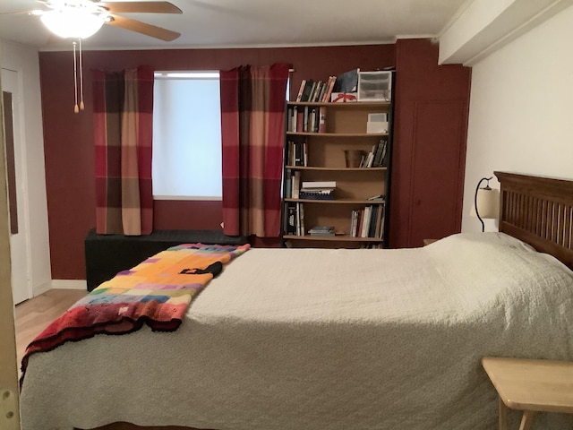 bedroom featuring ceiling fan and hardwood / wood-style flooring