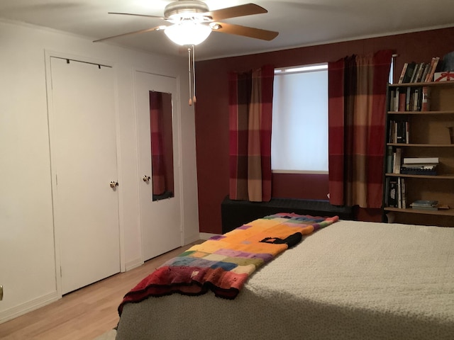 bedroom featuring ceiling fan and light hardwood / wood-style floors