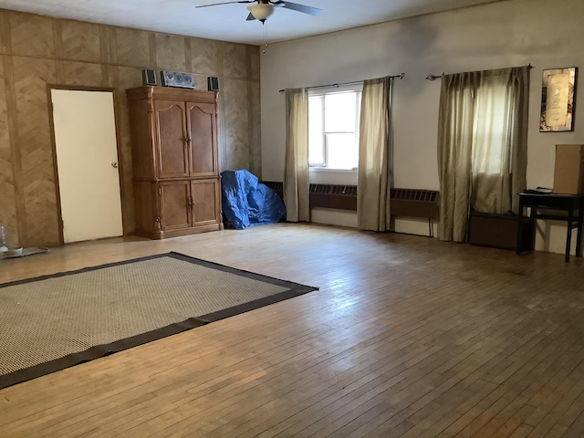 empty room featuring ceiling fan and light wood-type flooring