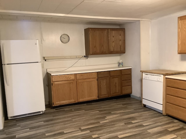 kitchen with dark wood-type flooring and white appliances