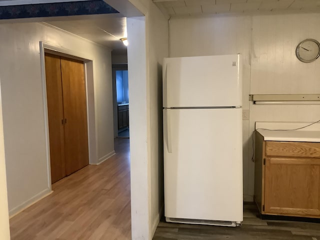 kitchen featuring white fridge and dark hardwood / wood-style floors