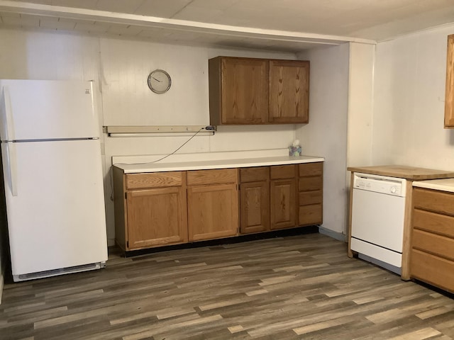 kitchen featuring dark hardwood / wood-style flooring and white appliances