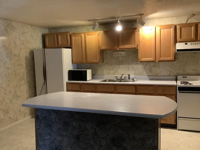 kitchen with decorative light fixtures, extractor fan, white electric range, sink, and rail lighting