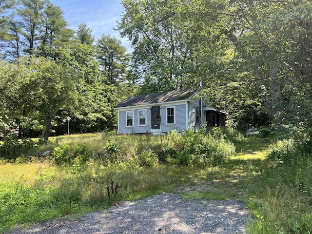 view of front of house featuring an outbuilding