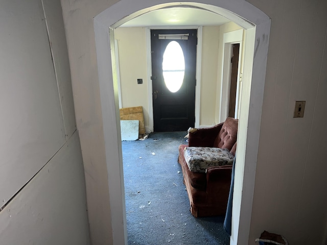 foyer with carpet flooring