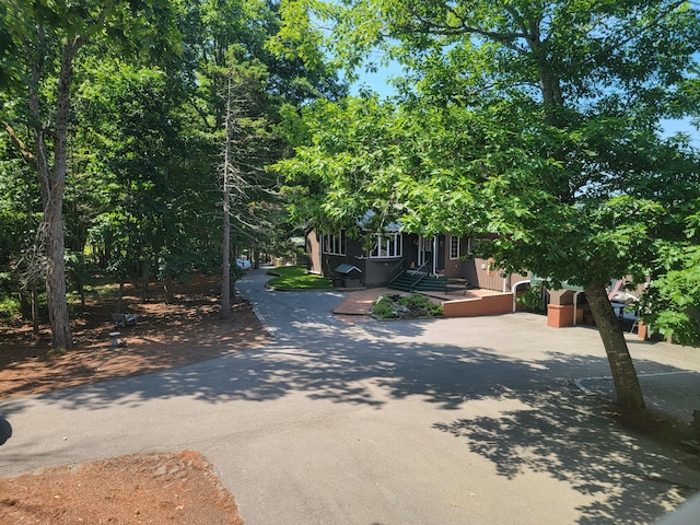 view of property hidden behind natural elements