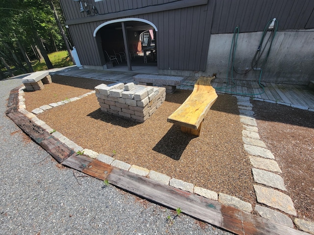 view of patio / terrace featuring an outdoor fire pit