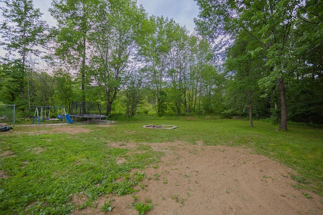 view of yard with a trampoline