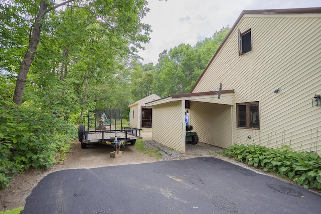 view of property exterior featuring a trampoline