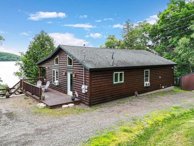 back of property with a wooden deck