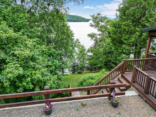 wooden terrace with a water view