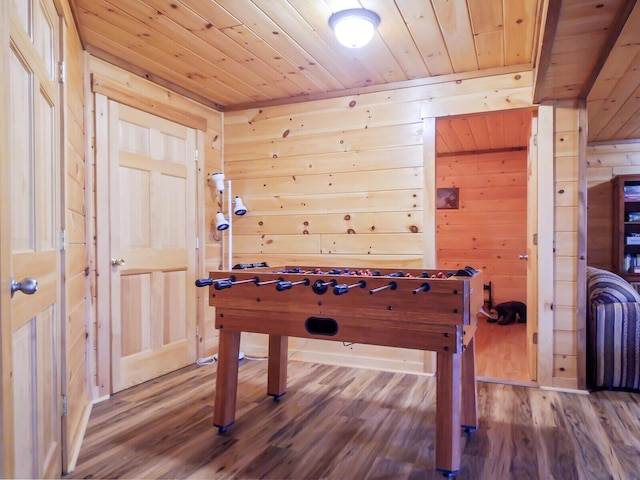 recreation room with wood-type flooring, wooden walls, and wooden ceiling