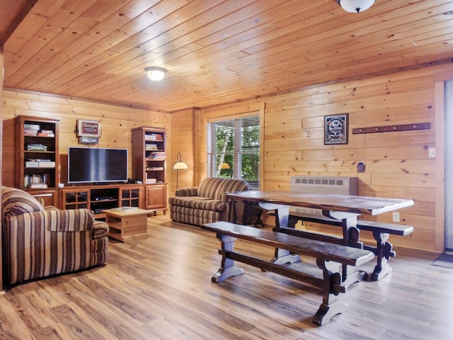 interior space featuring light hardwood / wood-style flooring, wooden ceiling, and wood walls